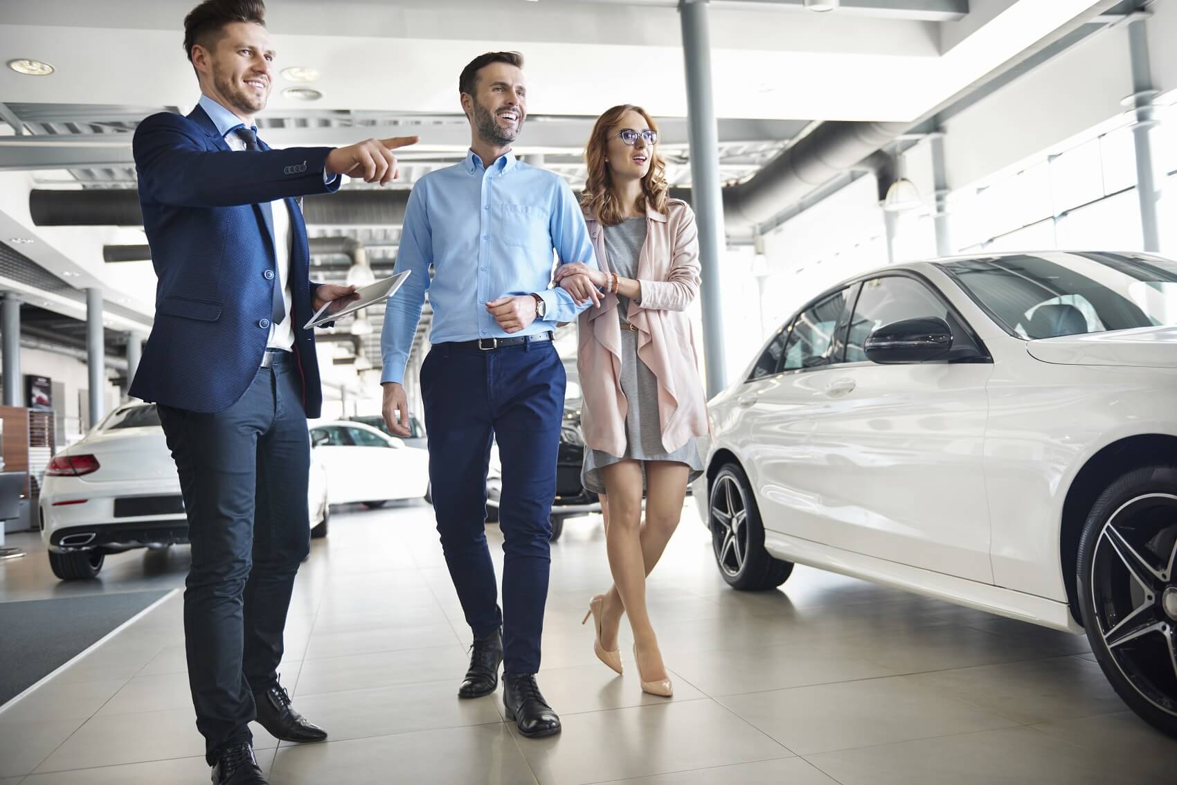 Sales Man Pointing at Vehicle