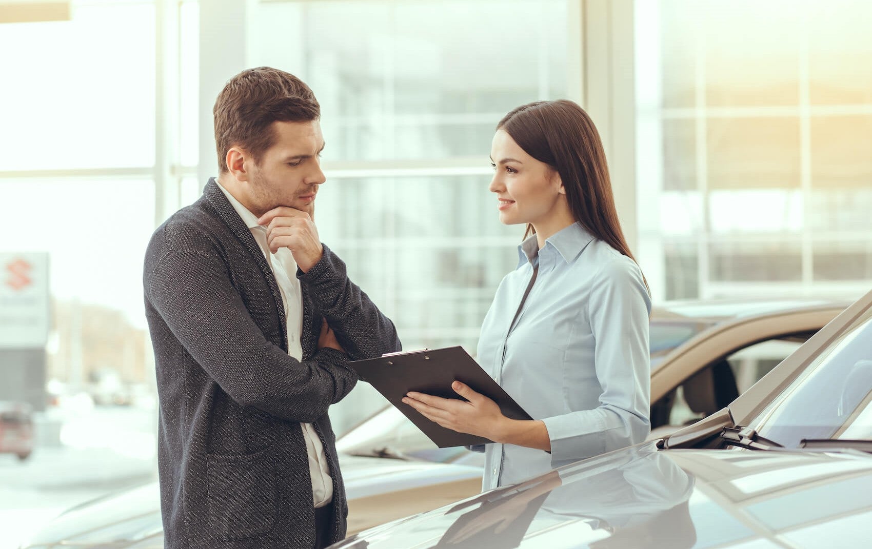 Man and Women Talking about Car Rates