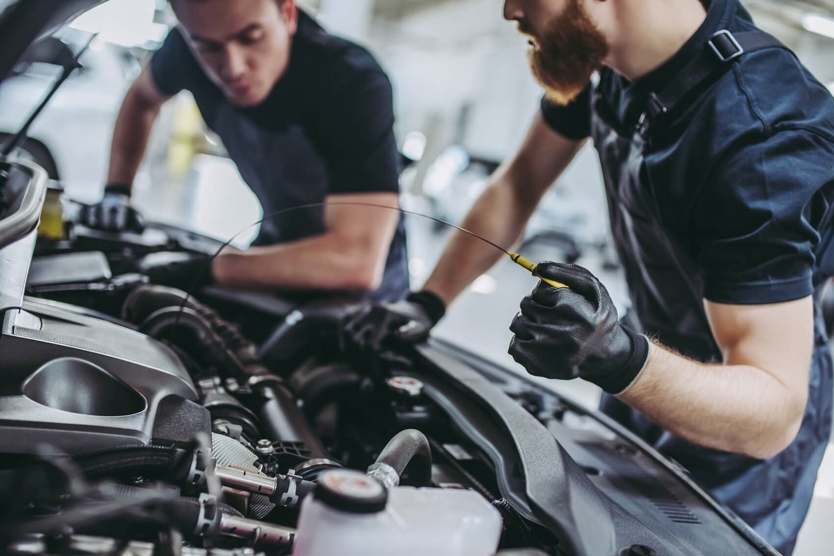 Two Men working on Vehicle